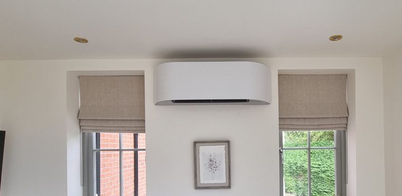 Toshiba Haori installation - uncovered Stylish room interior with window blinds and a sleek air conditioning unit above
